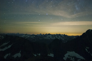 Scenic view of snowcapped mountains against sky during night - CAVF30305