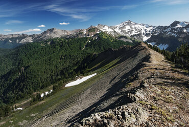 Scenic view of mountains against blue sky - CAVF30311