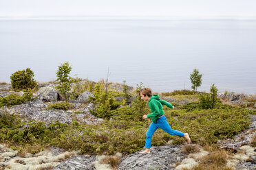 Boy running by sea - FOLF02361