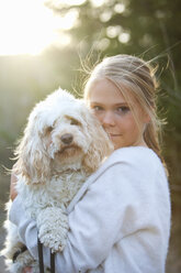 Girl holding dog - FOLF02395