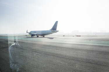 Airplane on runway against clear sky - CAVF30477