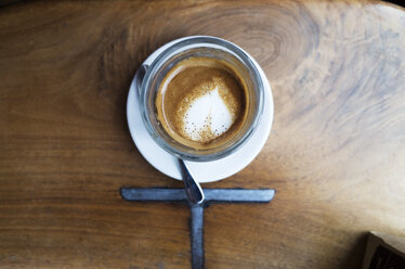 High angle view of coffee on wooden table - CAVF30489