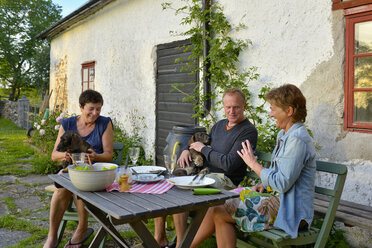 People sitting at table outdoor and talking - FOLF02531