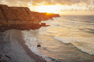 Scenic view of sea against cloudy sky during sunset - CAVF30680