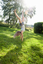 Teenage girl doing handstand - FOLF02610