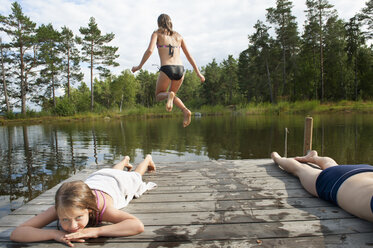 Girls resting near lake - FOLF02612