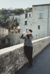 Young woman photographing with smart phone - FOLF03273