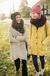 Two young women walking in park - FOLF03322