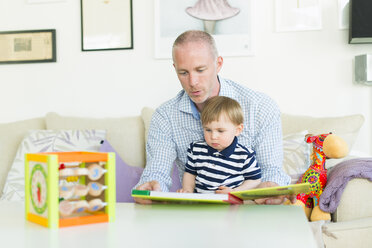 Man reading to his son - FOLF03352