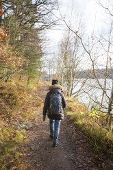 Woman on footpath by lake - FOLF03593