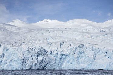 Scenic view of glacier and sea against sky - CAVF31074