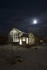 Exterior of illuminated greenhouse at night - FOLF04016