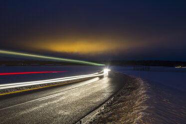 Light trail on road in winter at night - FOLF04027