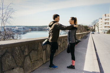 Couple stretching in Stockholm, Sweden - FOLF04897