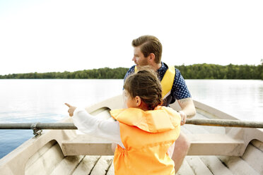 Girl in row boat with her father - FOLF05092