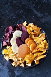 Sliced root vegetables and vegetable chips in bowl - CSF29035