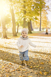 Little boy playing in autumn leaves - FOLF05237