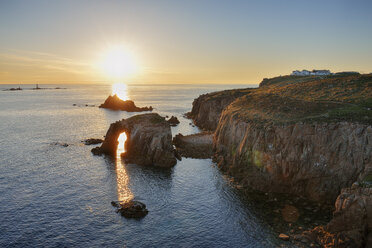 United Kingdom, England, Cornwall, Land's End, Natural Arche and Armed Knight at sunset - RUEF01848