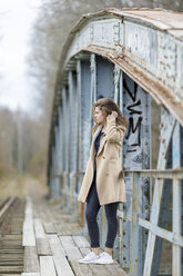 Teenage girl on bridge - FOLF05432