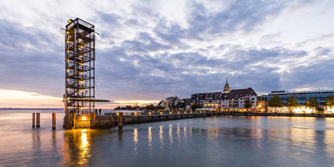 Germany, Baden-Wuerttemberg, Friedrichshafen, Lake Constance, city view and mole tower, harbour mole in the evening - WDF04523