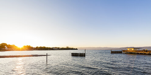 Germany, Baden-Wuerttemberg, Langenargen, Lake Constance, shipping pier at sunrise - WDF04524