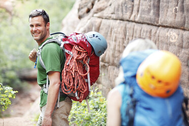 Happy couple with backpacks during hiking - CAVF31188