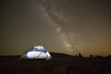 Illuminated tent on field against starry sky at night - CAVF31271