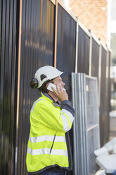 Man using smartphone in construction site - FOLF05808