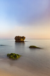 Rock formation amidst sea against clear sky - CAVF31589