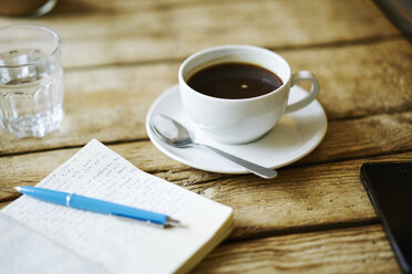 Notebook and coffee on table - FOLF06116
