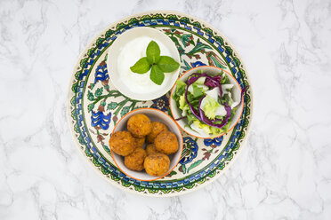 Falafel, salad, red and white cabbage, yogurt sauce with mint - LVF06846