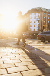 Man on street at sunset - FOLF06258