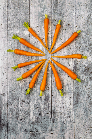 Baby carrots on wood stock photo