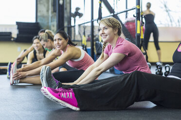 Happy female friends relaxing in health club - CAVF33116