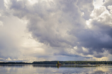 Lake among forests with little house on island - FOLF06615