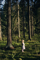 Girl standing in spruce forest - FOLF06807