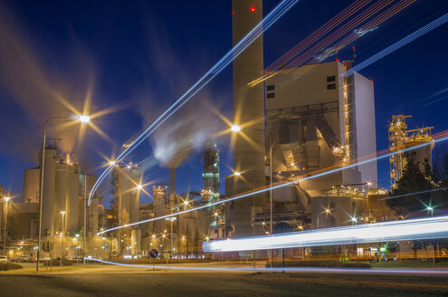 Light trails against factory at dusk - FOLF06840