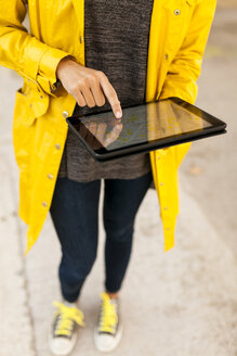 Close-up of woman using tablet with digital street map - VABF01529