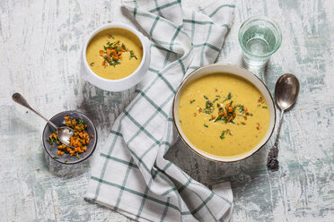 Bowls of vegan creamy carrot soup with coconut milk - SBDF03517