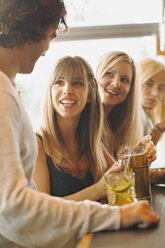 Man talking with women in bar - FOLF07277