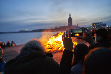 Person taking photo of bonfire - FOLF07322