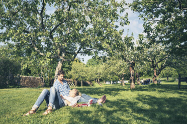 Couple relaxing on grass - FOLF07330