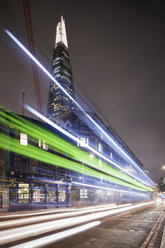 Illuminated Shard skyscraper in City of London with light trails in foreground - FOLF07402