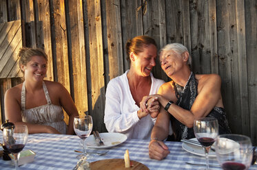 Grandmother, mother and daughter at table - FOLF07576