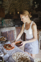 Woman preparing homemade pizzas - FOLF07653