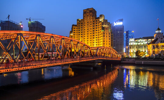 Bridge with city buildings in background at night - FOLF07794