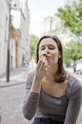 Young woman eating cookie - FOLF07880