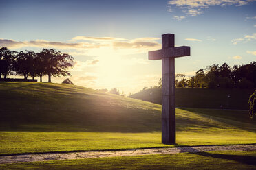 Cross in green valley at sunset - FOLF07946