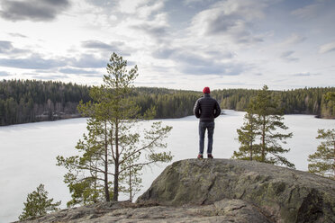 Mature hiker looking at forest - FOLF07984