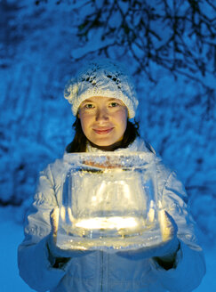 Woman holding ice lantern - FOLF08182